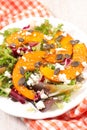 Vegetable salad with roasted pumpkin slices, cheese