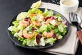 Vegetable salad with shrimp, sesame seeds, iceberg lettuce, romaine and radicchio salad