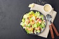 Vegetable salad with shrimp, sesame seeds, iceberg lettuce, romaine and radicchio salad