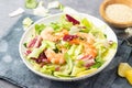 Vegetable salad with shrimp, sesame seeds and lettuce.