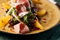 Vegetable salad with Smoked duck breast, close-up. Royalty Free Stock Photo