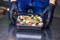 Vegetable salad with smoked eel in box ready for eating. Japanese Food Delivery Service Royalty Free Stock Photo