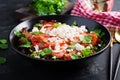 Vegetable salad with tomato, fresh lettuce, soft cheese and onion. Royalty Free Stock Photo