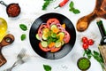 Vegetable salad. Tomatoes, cucumber, onions, parsley. Top view. Royalty Free Stock Photo