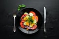 Vegetable salad. Tomatoes, cucumber, onions, parsley. Top view. Royalty Free Stock Photo