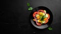 Vegetable salad. Tomatoes, cucumber, onions, parsley. Top view. Royalty Free Stock Photo