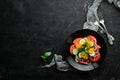 Vegetable salad. Tomatoes, cucumber, onions, parsley. Top view. Royalty Free Stock Photo