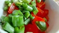 Vegetable salad in a white bowl, close-up. Mediterranean food.