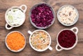 Vegetable salads in bowls o wooden table, top view