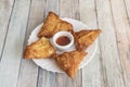 Vegetable samosas fried in oil with sauce Royalty Free Stock Photo