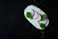 Vegetable sandwich on dark wooden board