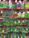 Vegetable seeds in packets on display stand for sale. Packets of different seeds