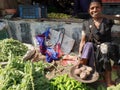 Vegetable seller in local vegetable market in India