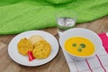 Vegetable slices and pea mash and carrot soup on a table Royalty Free Stock Photo