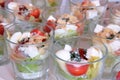 Vegetable snacks in glasses on banquet table. Treats for guests at celebration