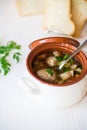 Vegetable soup with beans and meatballs in a ceramic bowl Royalty Free Stock Photo