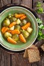 Vegetable soup with brussel sprouts on wooden rustic table Royalty Free Stock Photo