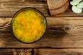 Vegetable soup in a glass bowl on wooden table. Top view Royalty Free Stock Photo