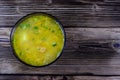 Vegetable soup in a glass bowl on wooden table. Top view Royalty Free Stock Photo