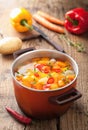 Vegetable soup in red pot Royalty Free Stock Photo