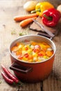 Vegetable soup in red pot Royalty Free Stock Photo