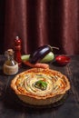 Vegetable Spiral tart with zucchini, eggplant, carrot on wooden background