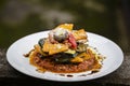 Vegetable stack - pumpkin, zucchini, red capsicum, eggplant and mushroom cooked in a tomato, onion, and garlic sauce topped with p