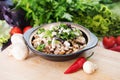 Vegetable stew with greens and mushrooms in bowl. Vegetarian coo