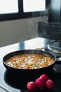 Vegetable stew in a pan at the modern kitchen