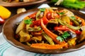 Vegetable stew salad: bell pepper, eggplant, asparagus beans, garlic, carrot, leek. Bright spicy aromatic dishes. Royalty Free Stock Photo