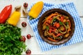 Vegetable stew salad: bell pepper, eggplant, asparagus beans, garlic, carrot, leek. Bright spicy aromatic dishes. Royalty Free Stock Photo