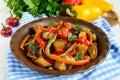 Vegetable stew salad: bell pepper, eggplant, asparagus beans, garlic, carrot, leek. Bright spicy aromatic dishes. Royalty Free Stock Photo