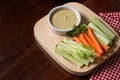 Vegetable sticks. Fresh celery and carrot, cucumber with sauce. Royalty Free Stock Photo