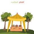 Vegetable tent market stall on the grass in front of green trees. Cartoon flat style vector illustration