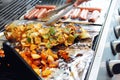 Vegetable tofu and hot dog grilling on grill Royalty Free Stock Photo