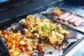 Vegetable tofu and hot dog grilling on grill Royalty Free Stock Photo