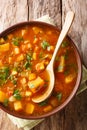 Vegetable vegetarian sweet potato with lentil soup close-up in a bowl. Vertical top view Royalty Free Stock Photo