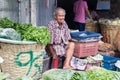 Vegetable vendor at Pak Khlong Talat market waiting for business, Bangkok, Thailand