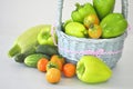 Large Peppers cucumbers and tomatoes green in basket Royalty Free Stock Photo