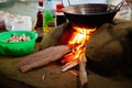 Vegetables being fried over a wood fired stove made out of mud a Royalty Free Stock Photo