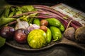 Vegetables in cast iron pan - beets and garlic and jalepeno peppers and plums - selective focus Royalty Free Stock Photo