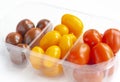Vegetables, cherry tomatoes in three colors in a plastic transparent box Royalty Free Stock Photo