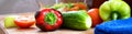 Vegetables in close-up on the cutting Board. Ripe tomatoes, cucumbers, bell peppers, parsley, garlic, diet, vitamin salad. Front Royalty Free Stock Photo