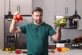 Vegetables diet. Young woman eating healthy food, dieting. Guy eating vegetable diet salad in studio. Vegan salad. Male Royalty Free Stock Photo