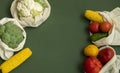 Vegetables in eco bag on green surface with a copy space. Pepper, tomato, corn, cucumber, broccoli, cauliflower in Royalty Free Stock Photo