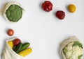 Vegetables in eco bag on white surface with a copy space. Pepper, tomato, corn, cucumber, broccoli, cauliflower in Royalty Free Stock Photo