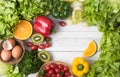 Vegetables and fruit on wood background, healthy food Royalty Free Stock Photo