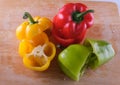 Red, yellow and green peppers, levitation on a black background Royalty Free Stock Photo