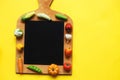 vegetables and fruits on the cutting board on yellow background. healthy cooking concept Royalty Free Stock Photo