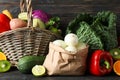 Vegetables, fruits, wicker basket and paper bag on wood background Royalty Free Stock Photo